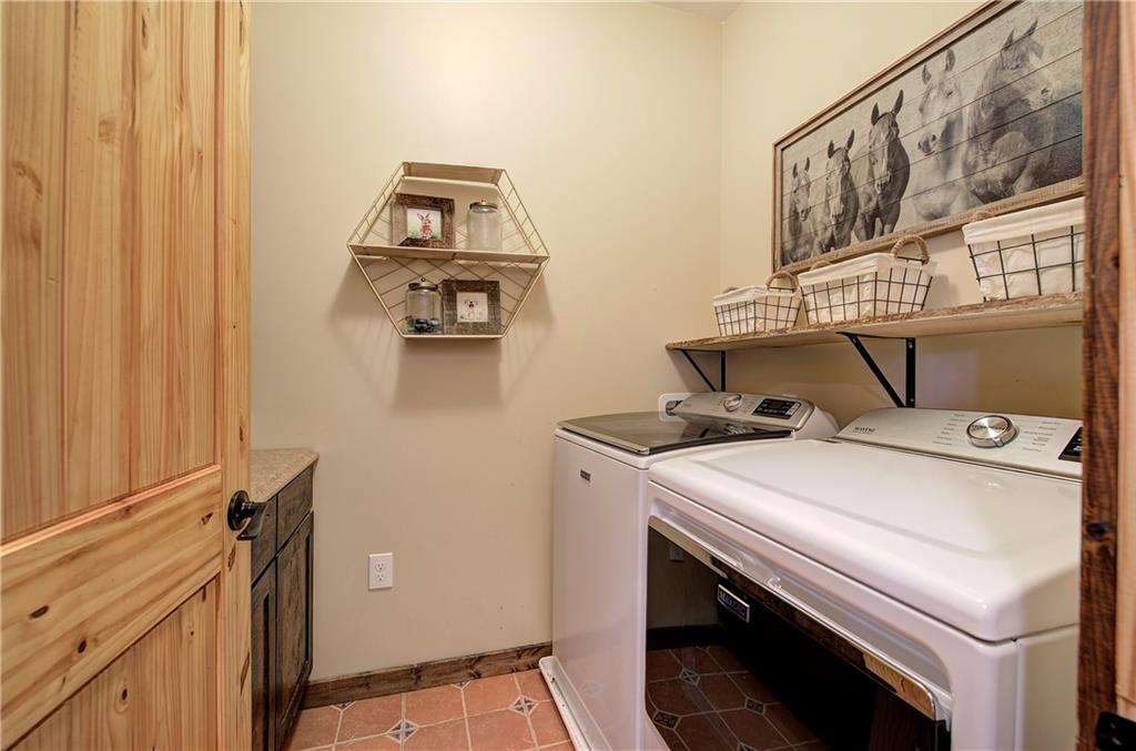 100 Buckwood Farms Path Dallas, GA 30132 - Photo 25 of 70 a utility room with dryer and washer