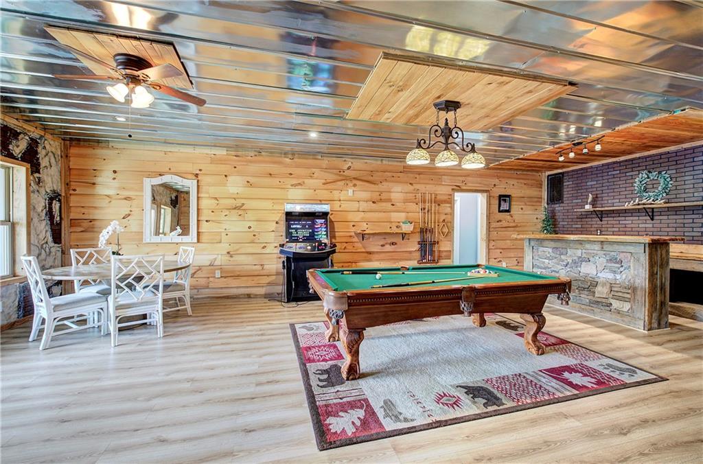 100 Buckwood Farms Path Dallas, GA 30132 - Photo 26 of 70 a living room with furniture a fireplace and wooden floor