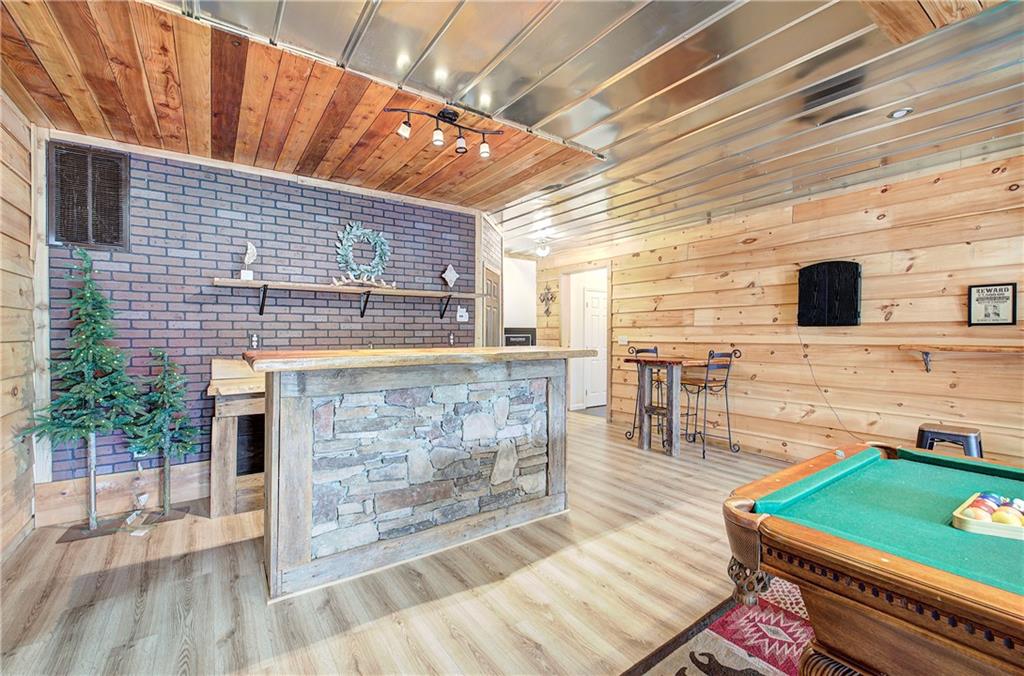 100 Buckwood Farms Path Dallas, GA 30132 - Photo 27 of 70 a view of a chairs and table on the wooden floor