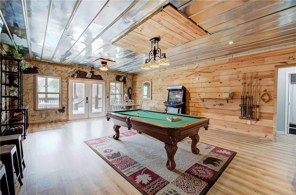 100 Buckwood Farms Path Dallas, GA 30132 - Photo 28 of 70 a room with furniture pool table wooden floor and windows