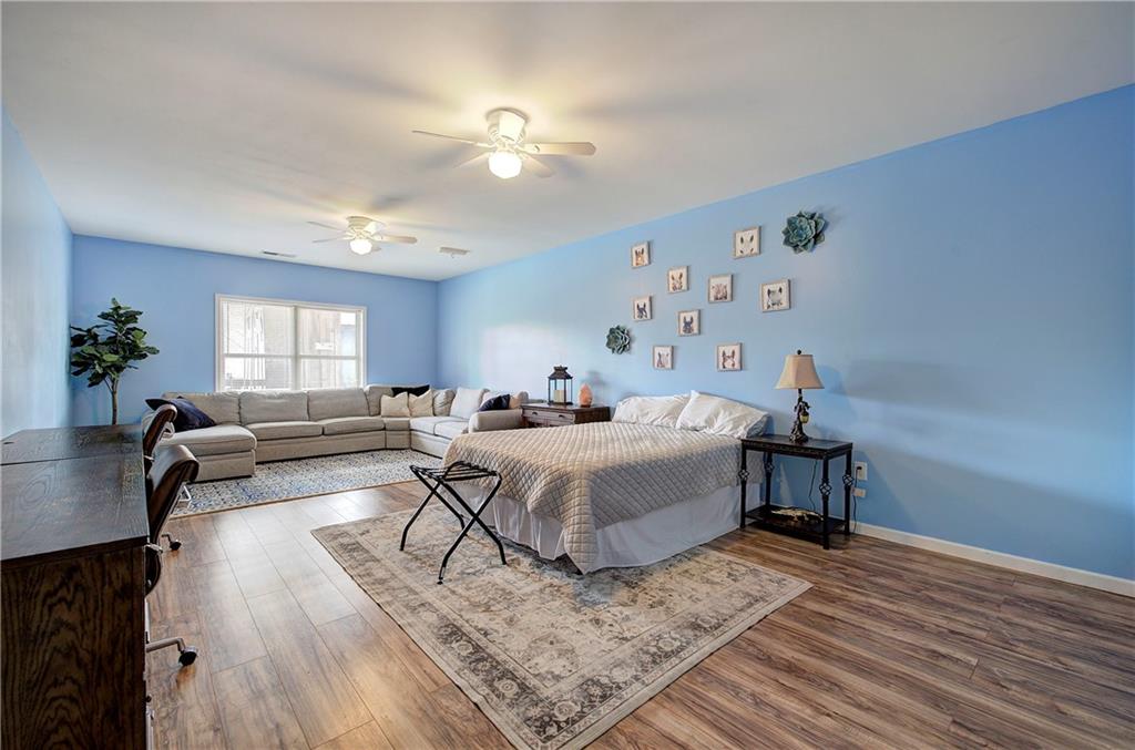 100 Buckwood Farms Path Dallas, GA 30132 - Photo 30 of 70 a living room with furniture and a wooden floor