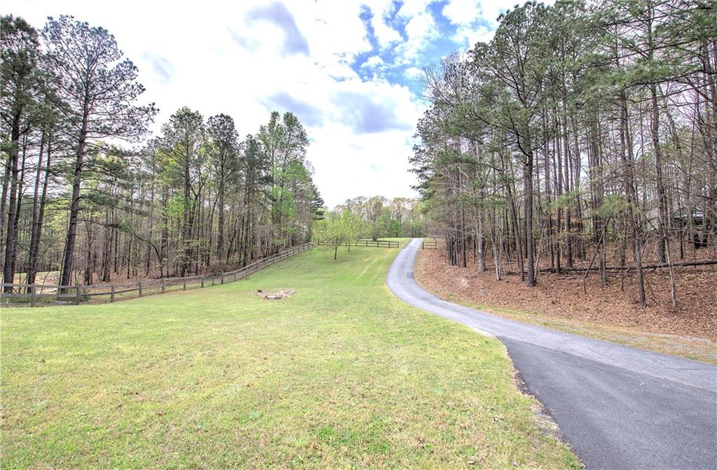 100 Buckwood Farms Path Dallas, GA 30132 - Photo 34 of 70 a view of a backyard with large trees