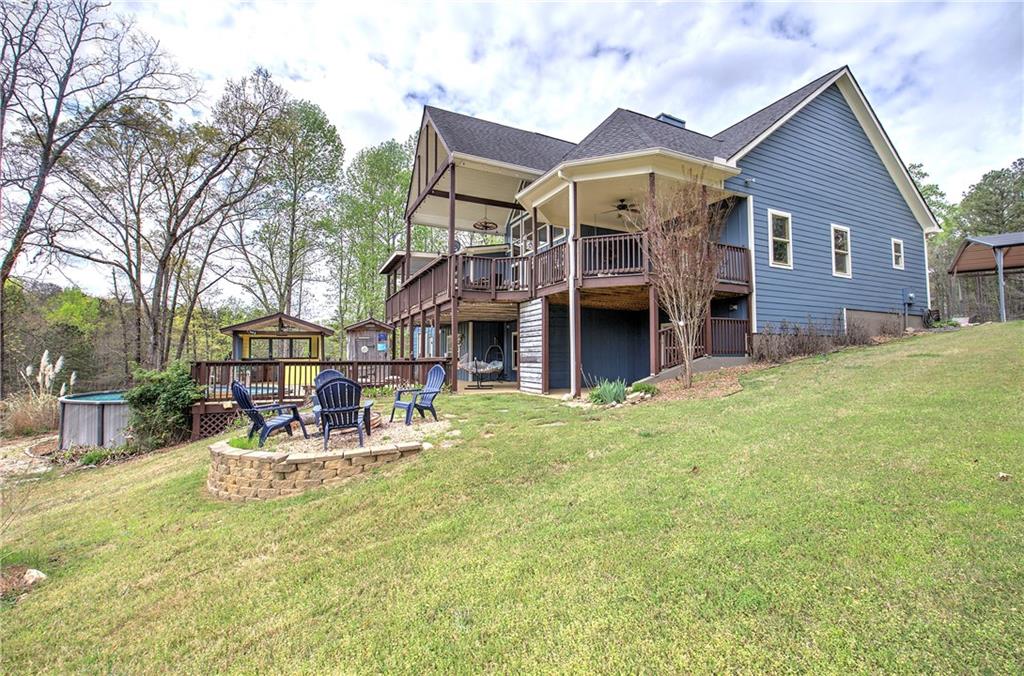 100 Buckwood Farms Path Dallas, GA 30132 - Photo 43 of 70 a view of a house with a yard and sitting area