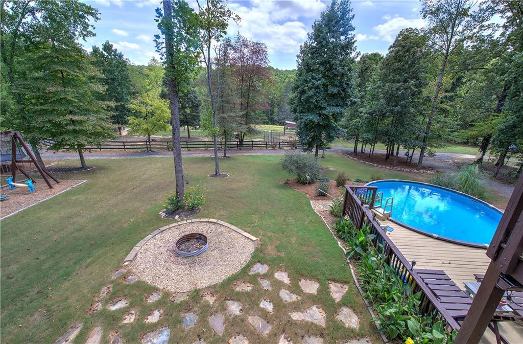 100 Buckwood Farms Path Dallas, GA 30132 - Photo 44 of 70 a view of a swimming pool with a yard