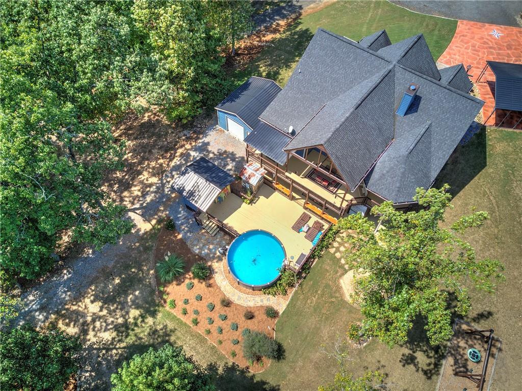100 Buckwood Farms Path Dallas, GA 30132 - Photo 45 of 70 an aerial view of a house with a swimming pool