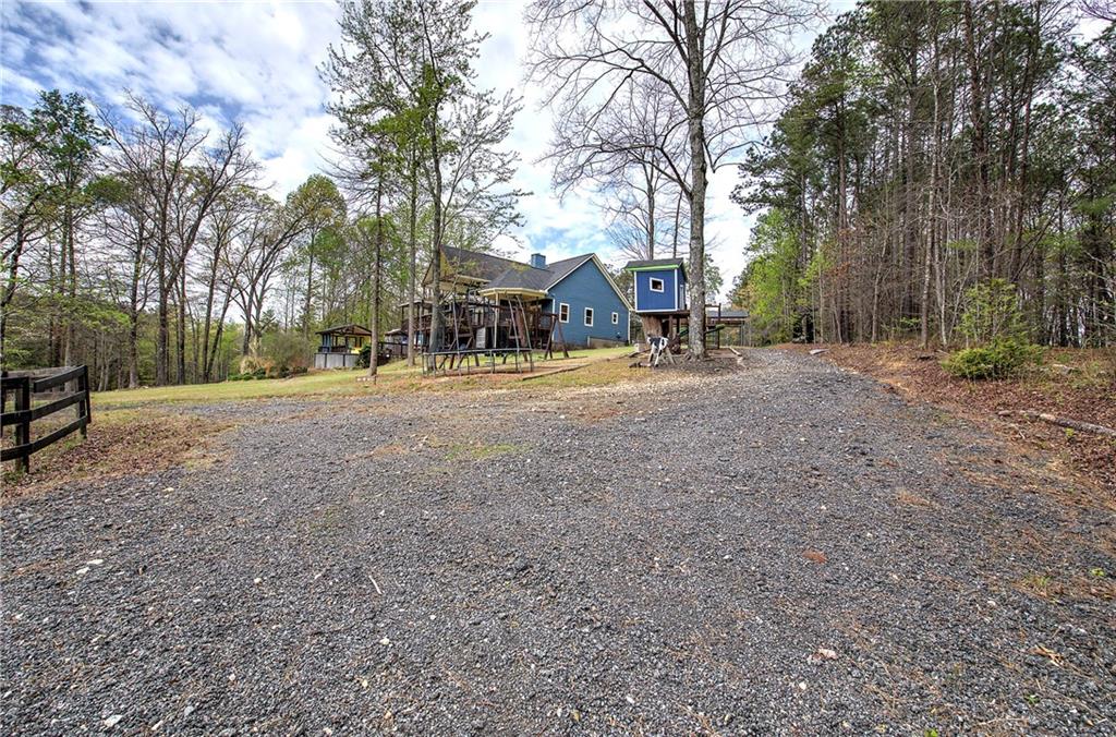 100 Buckwood Farms Path Dallas, GA 30132 - Photo 51 of 70 a front view of a house with a yard and garage