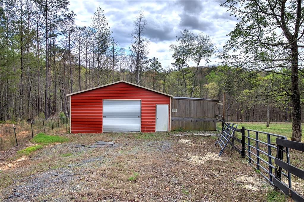 100 Buckwood Farms Path Dallas, GA 30132 - Photo 52 of 70 a backyard of a house with lots of green space