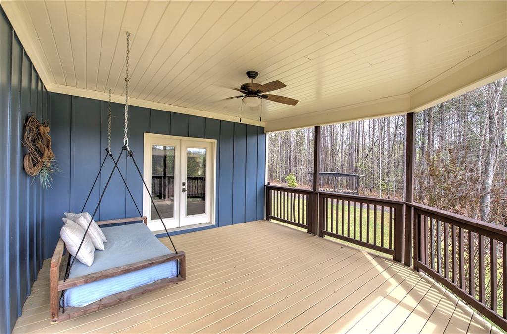 100 Buckwood Farms Path Dallas, GA 30132 - Photo 66 of 70 a view of a balcony with stairs and a ceiling fan
