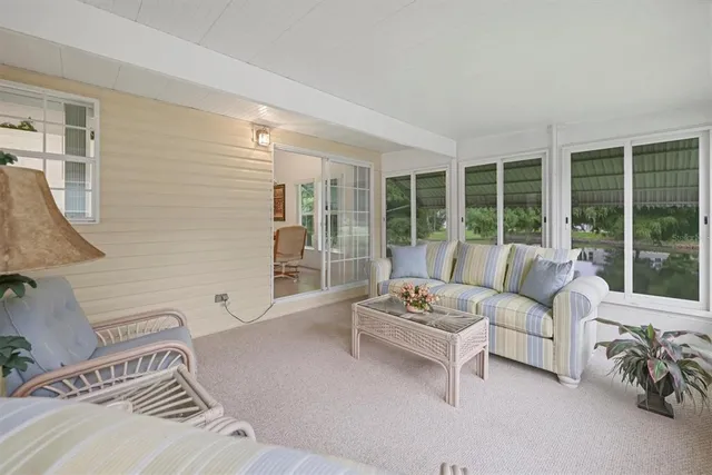 a view of a lake with a house in the background