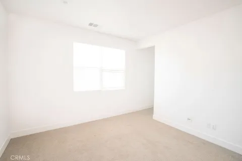 a spacious bathroom with a shower sink and mirror