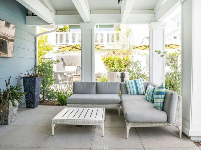 a view of pool with table and chairs