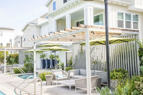 a view of backyard with a table and chairs