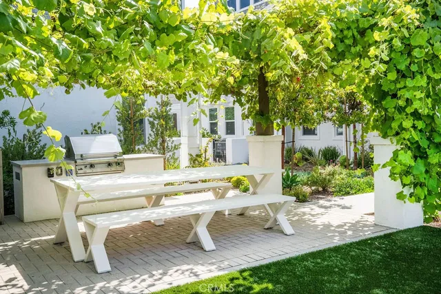 a kitchen with stainless steel appliances a sink stove and cabinets