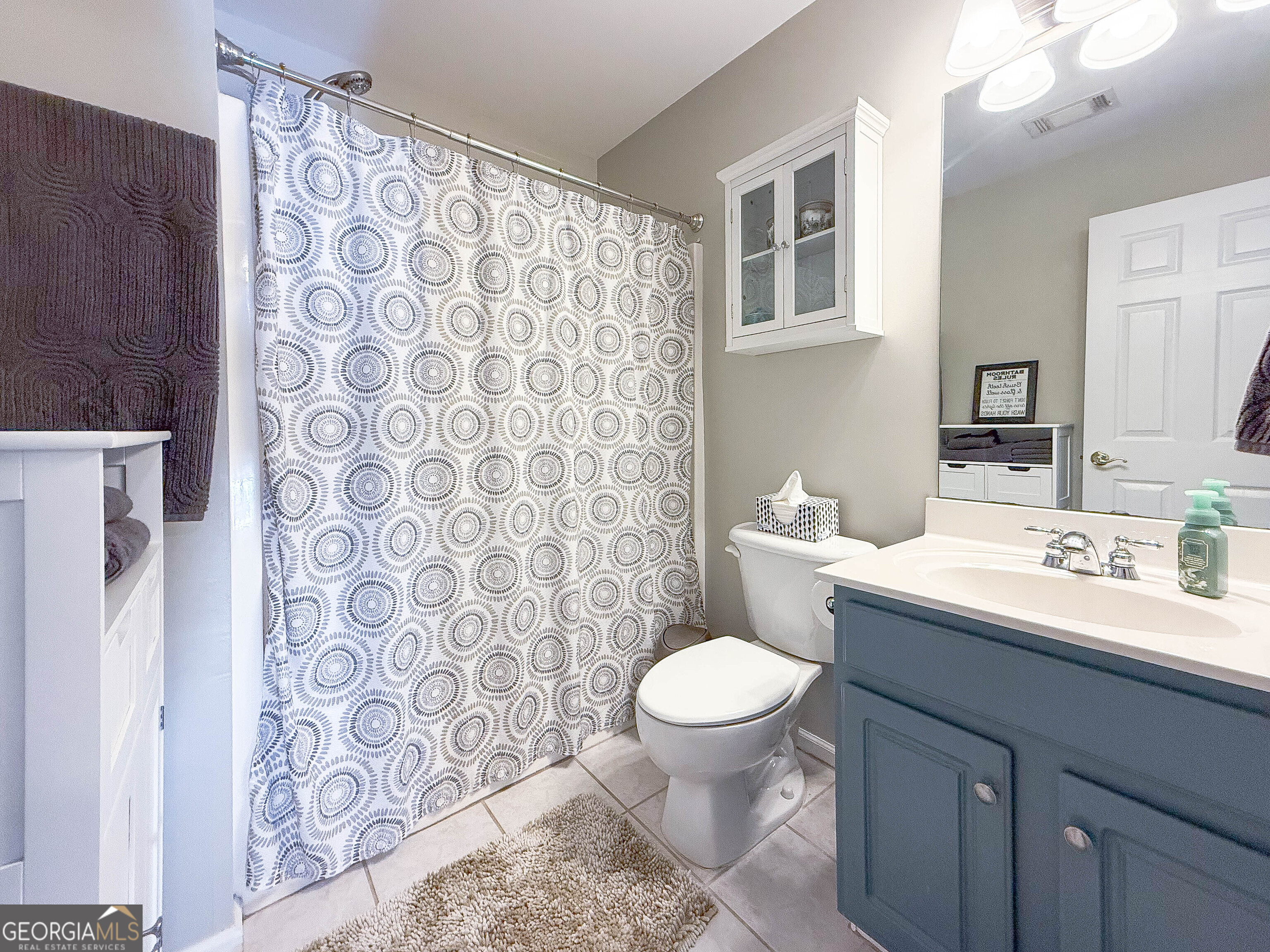38 The Promenade Newnan, GA 30265 - Photo 11 of 22 a bathroom with a toilet sink and mirror