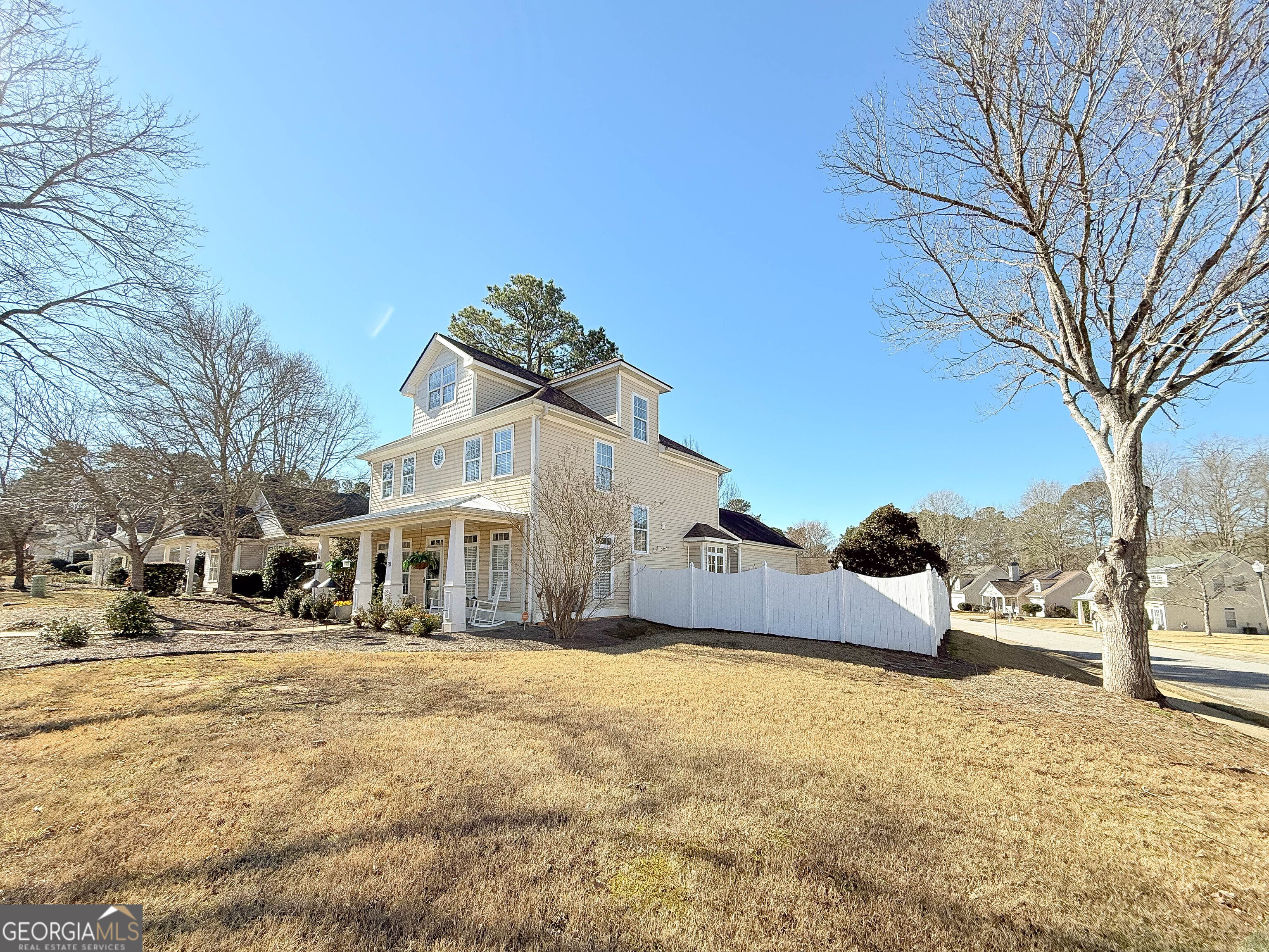 38 The Promenade Newnan, GA 30265 - Photo 16 of 22 a house with trees in front of it