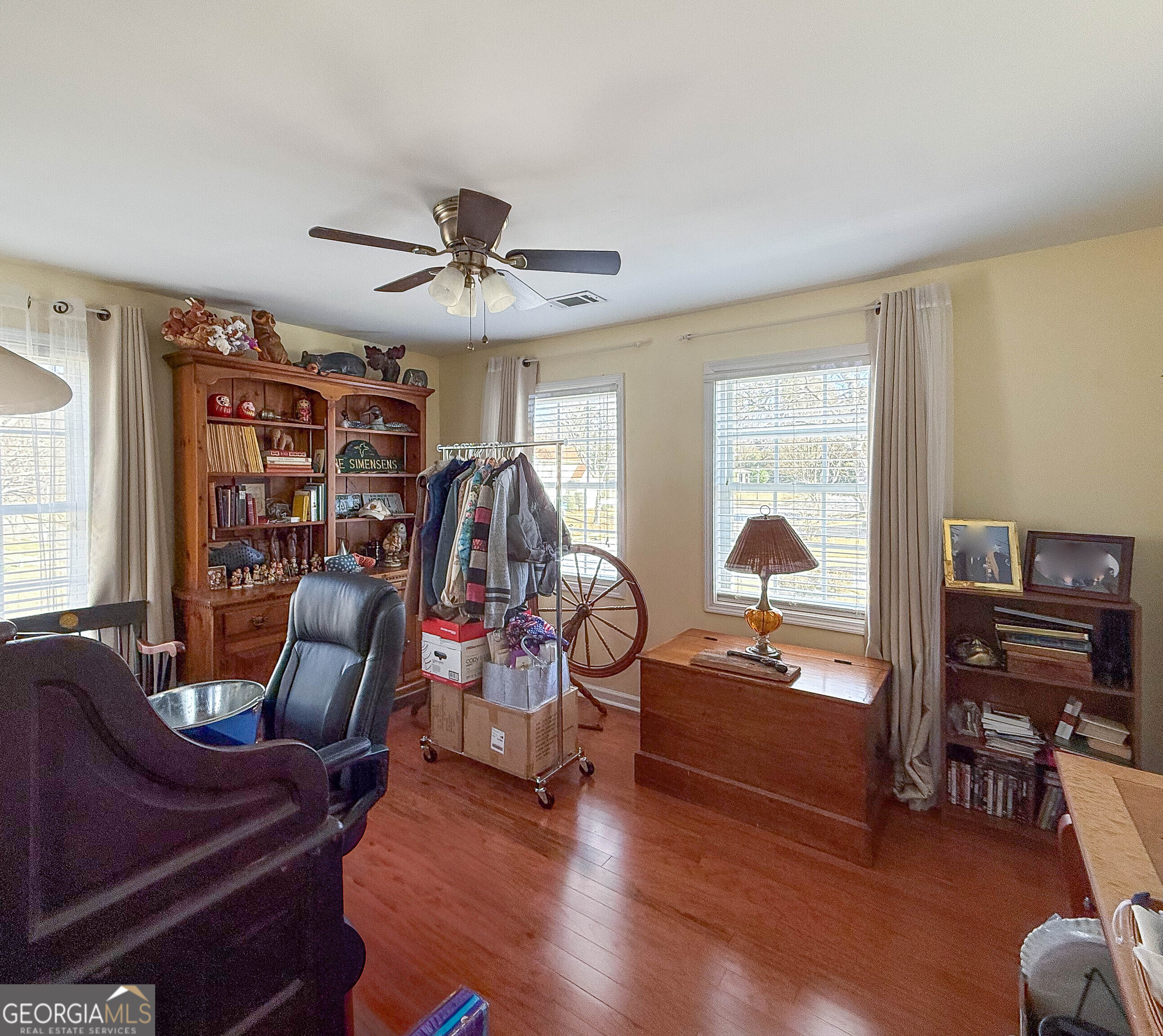 38 The Promenade Newnan, GA 30265 - Photo 4 of 22 a living room with furniture a ceiling fan and a window