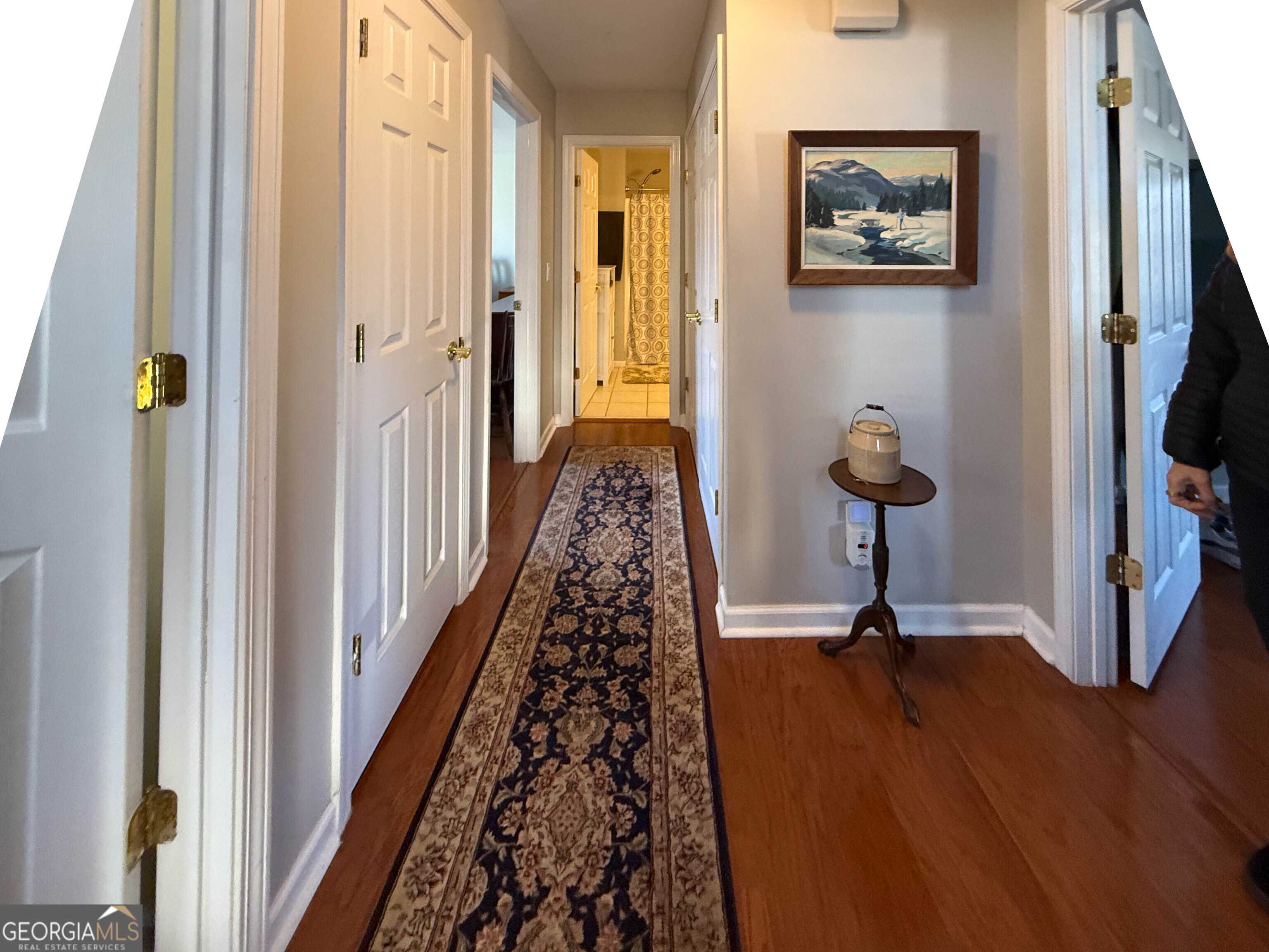 38 The Promenade Newnan, GA 30265 - Photo 5 of 22 a view of a hallway with wooden floor and staircase