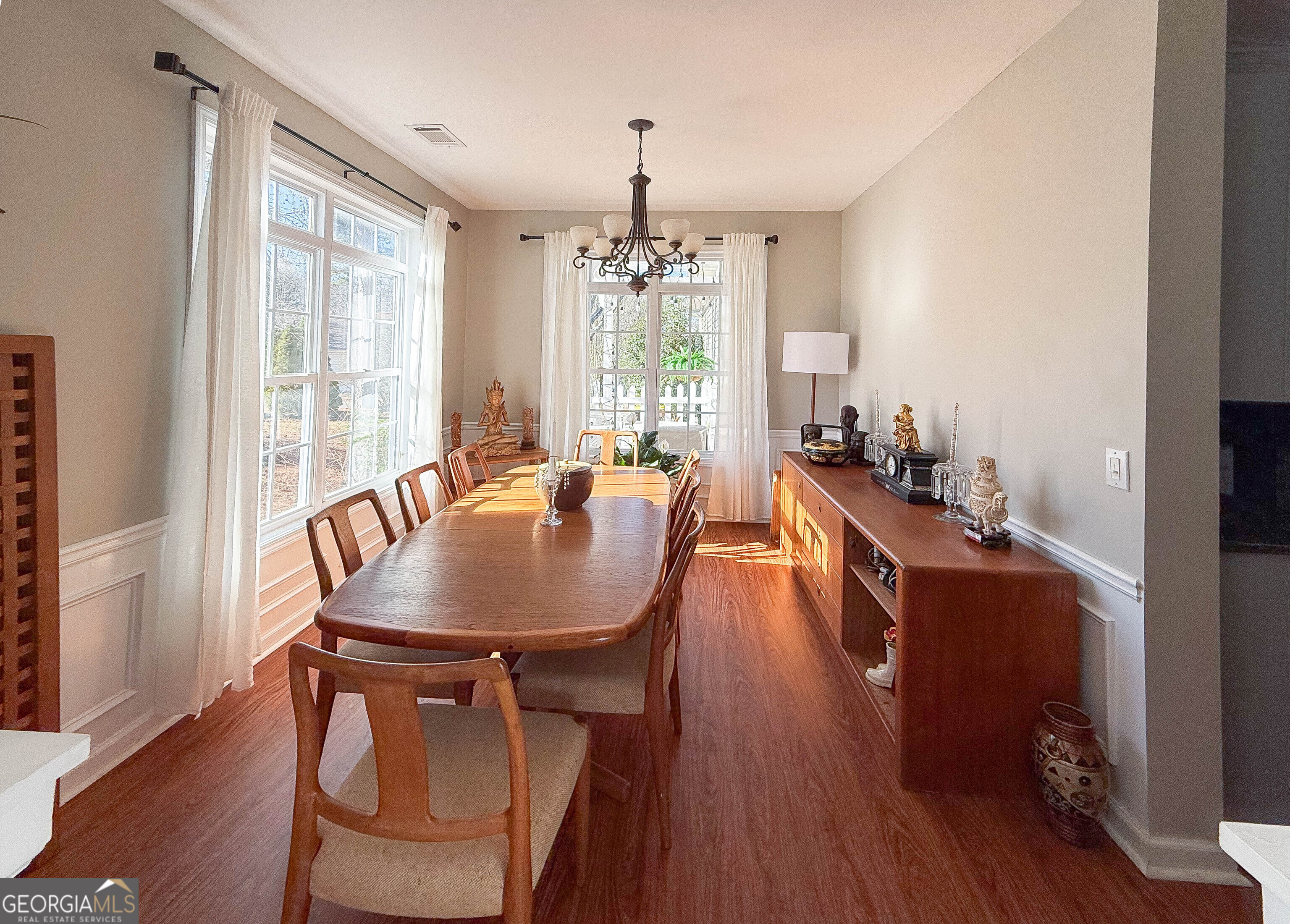 38 The Promenade Newnan, GA 30265 - Photo 6 of 22 a dining room with furniture window wooden floor