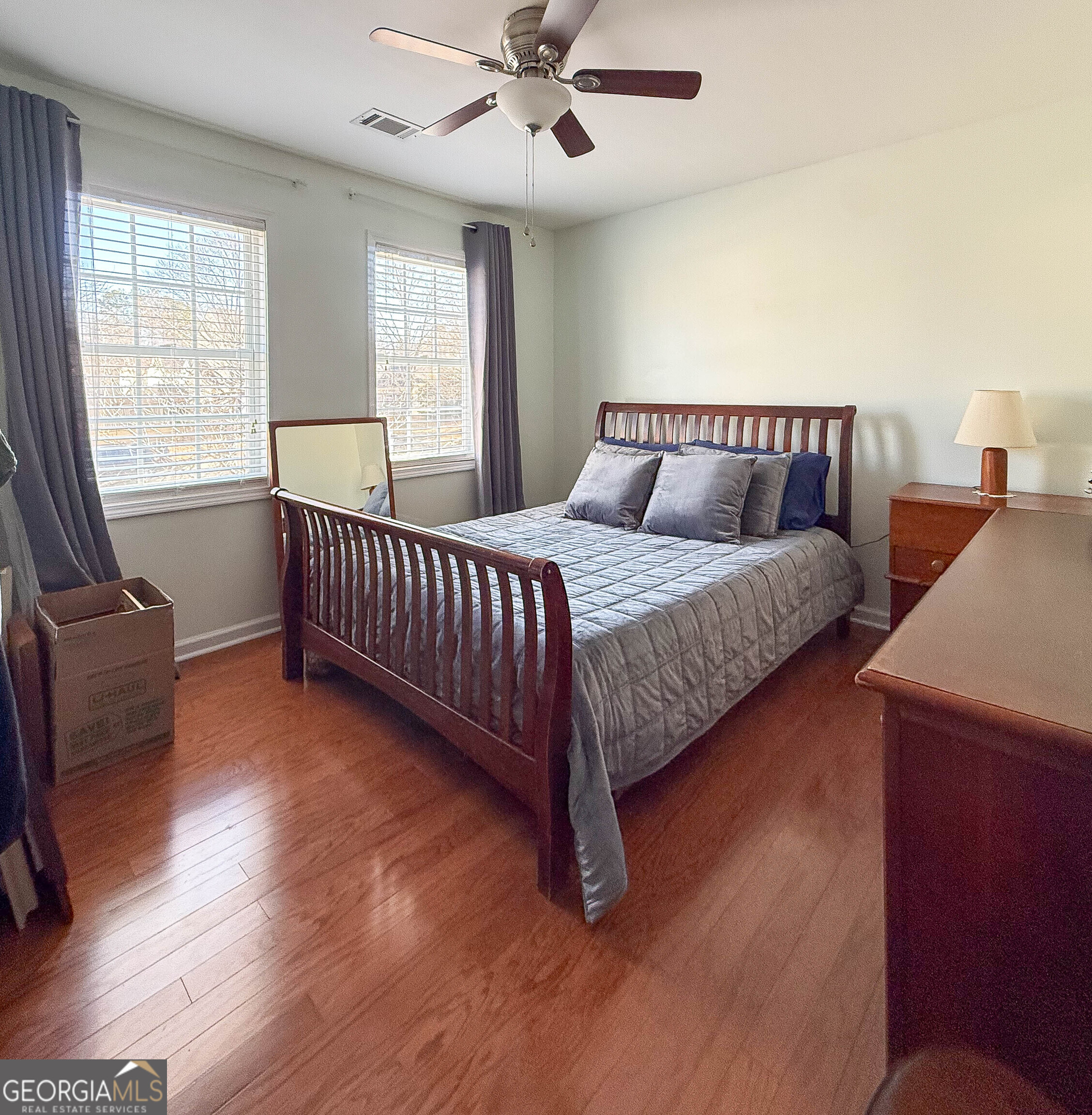 38 The Promenade Newnan, GA 30265 - Photo 10 of 22 a spacious bedroom with a bed and a window