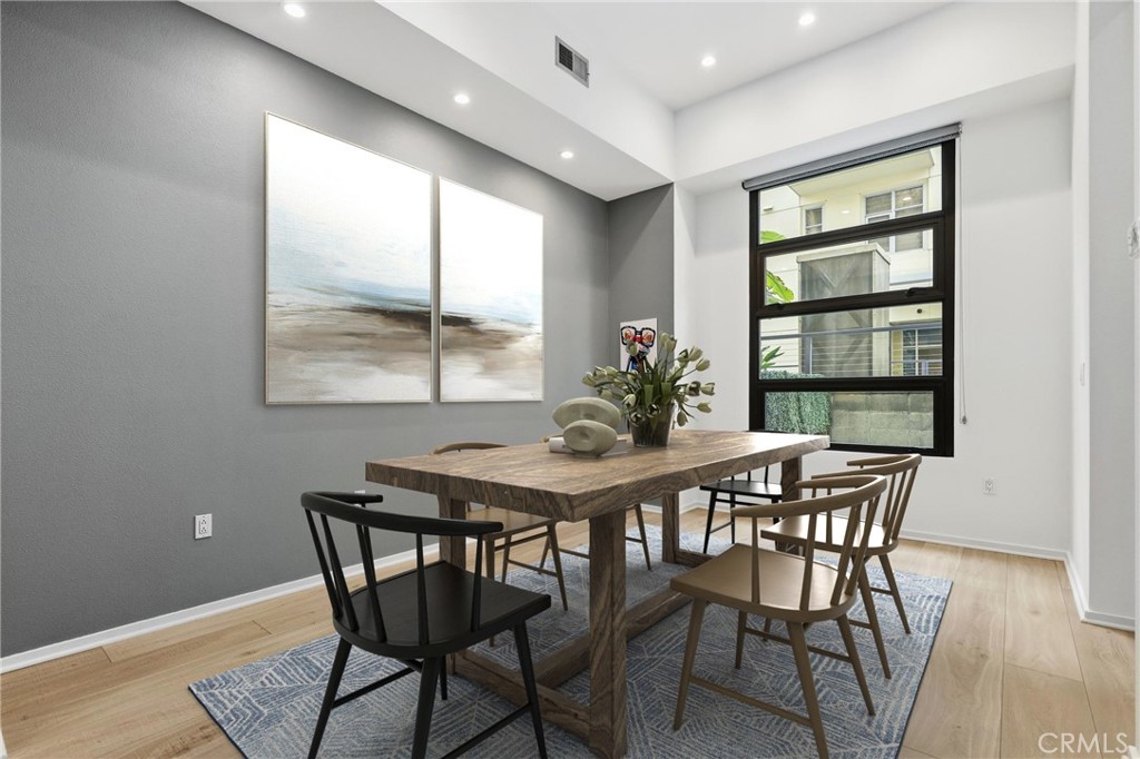 133 The Promenade North, Unit 118 Long Beach, CA 90802 - Photo 11 of 35 a view of a dining room with furniture window and outside view