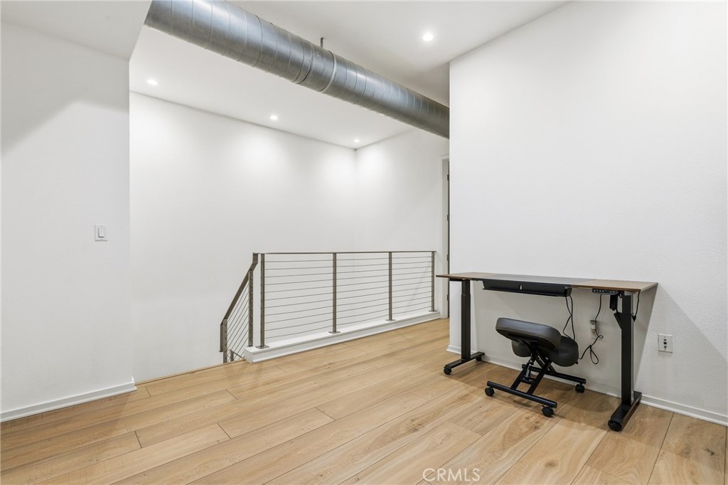 133 The Promenade North, Unit 118 Long Beach, CA 90802 - Photo 23 of 35 a view of a hallway with wooden floor