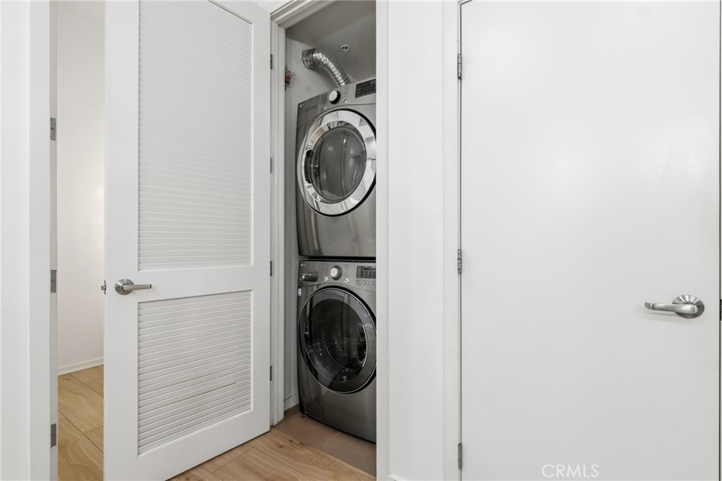 133 The Promenade North, Unit 118 Long Beach, CA 90802 - Photo 24 of 35 a view of a hallway with washer and dryer