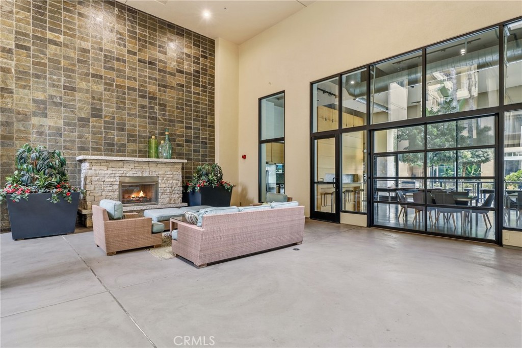 133 The Promenade North, Unit 118 Long Beach, CA 90802 - Photo 27 of 35 a living room with furniture and a fireplace