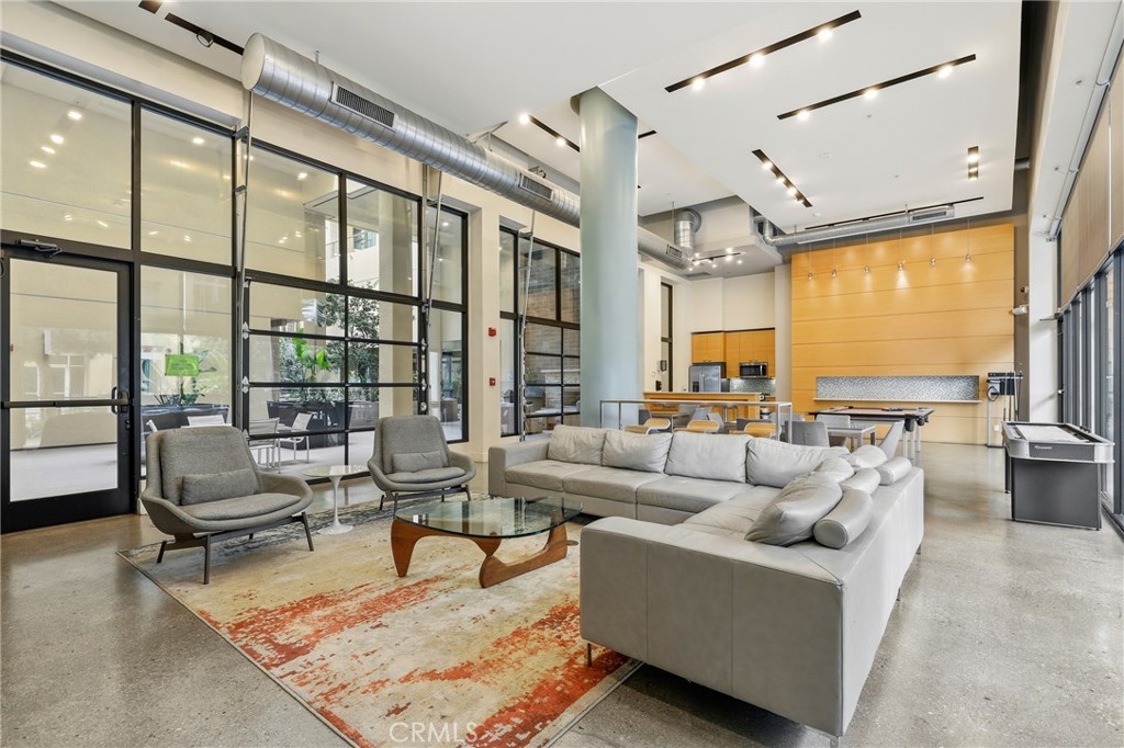 133 The Promenade North, Unit 118 Long Beach, CA 90802 - Photo 28 of 35 a living room with furniture and a large window