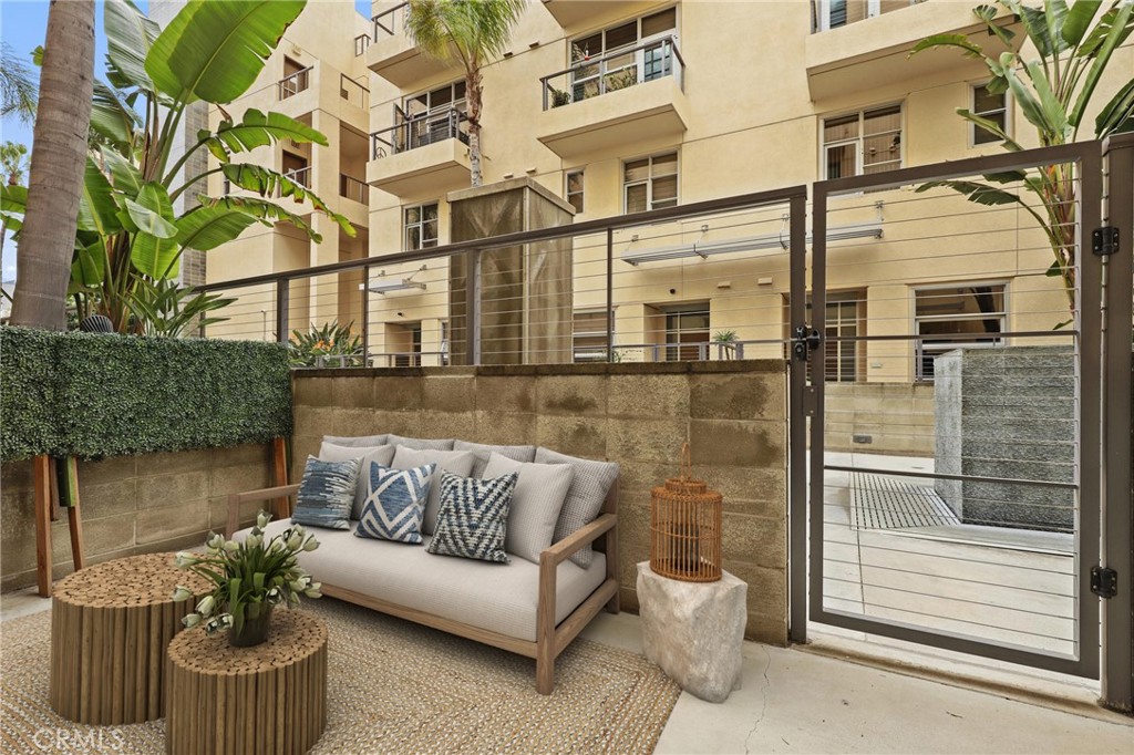 133 The Promenade North, Unit 118 Long Beach, CA 90802 - Photo 4 of 35 a view of a patio with couches and potted plants