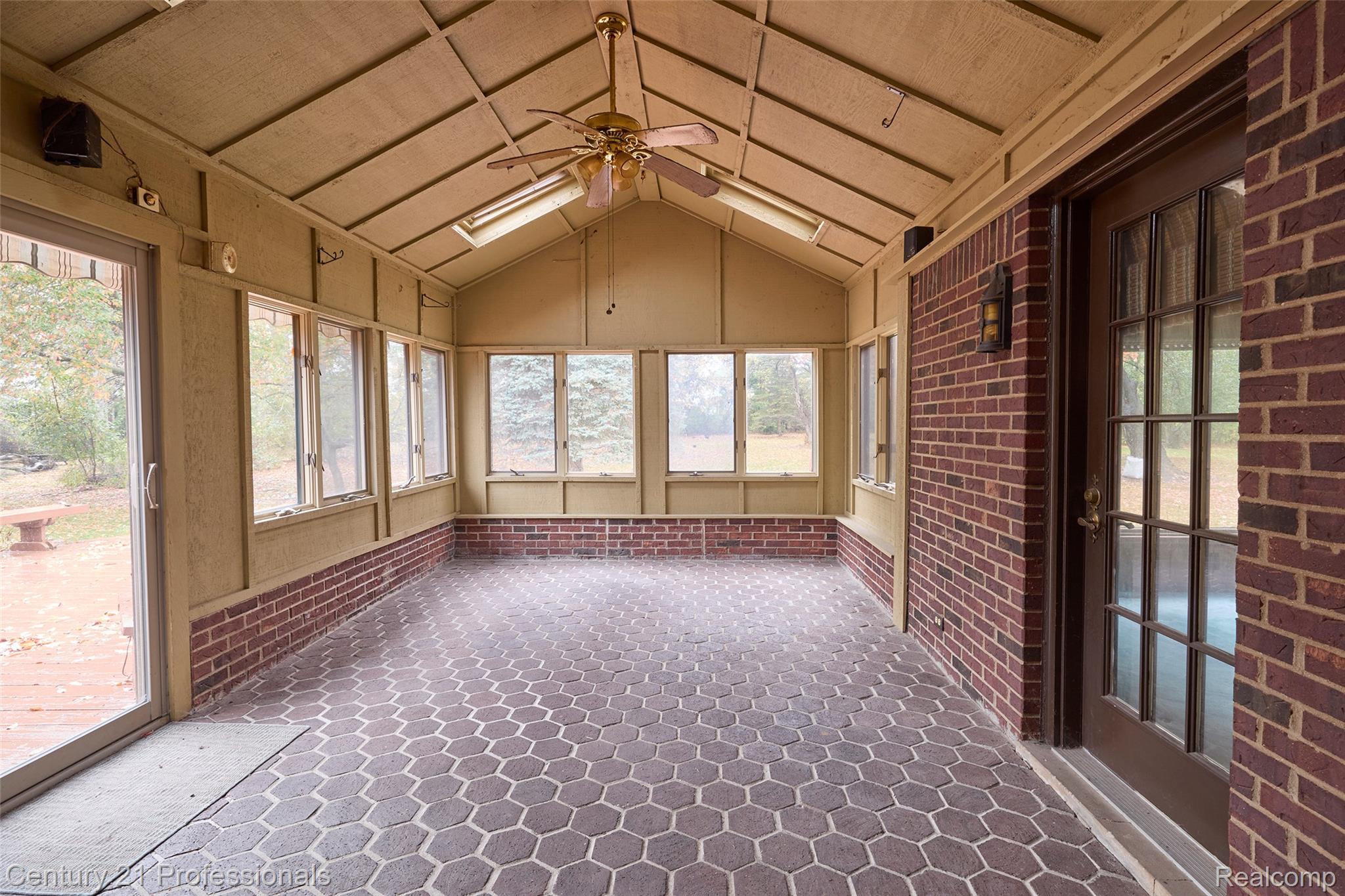 303 East Snell Road Rochester, MI 48306 - Photo 12 of 45 4 seasons room, attached off kitchen / breakfast room area with slider to outside deck and yard