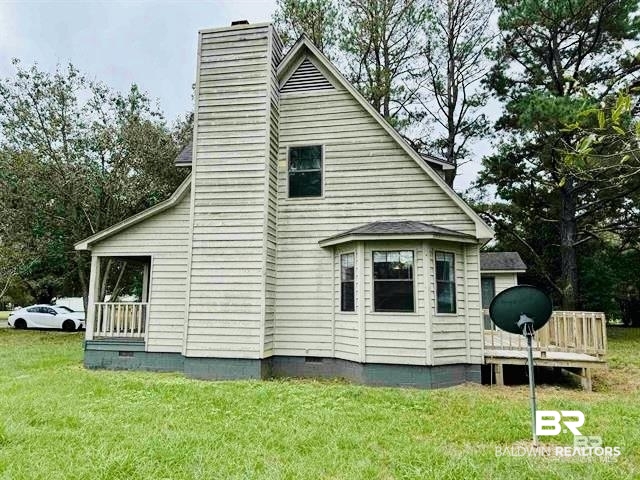 70 Plum Street Uriah, AL 36480 - Photo 29 of 36 Exterior space featuring a yard