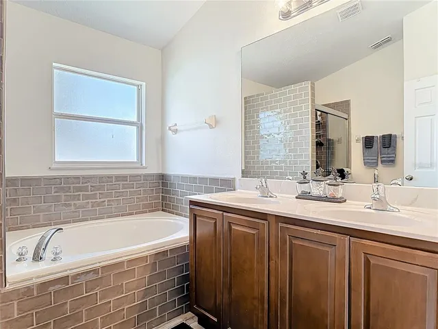 a view of an empty room with windows