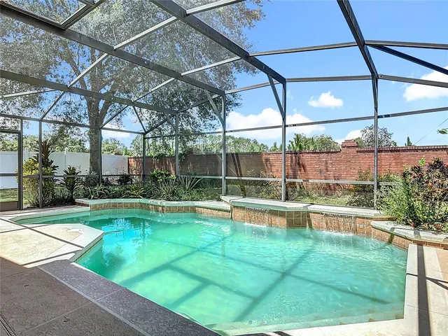 a view of a backyard with sitting area