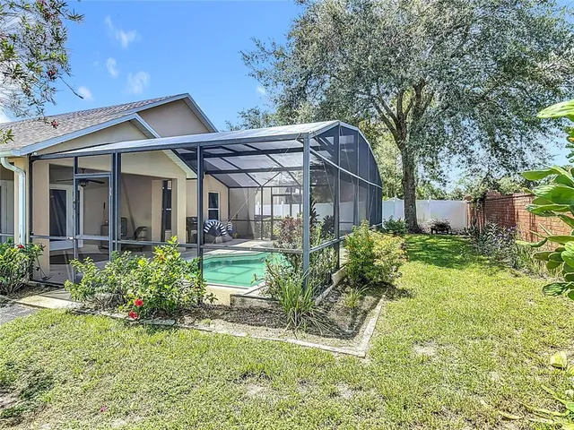 a backyard of a house with lots of green space