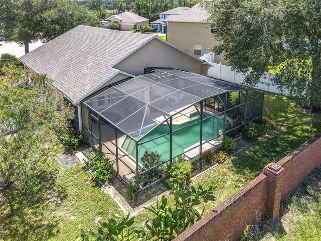an aerial view of a house with a garden