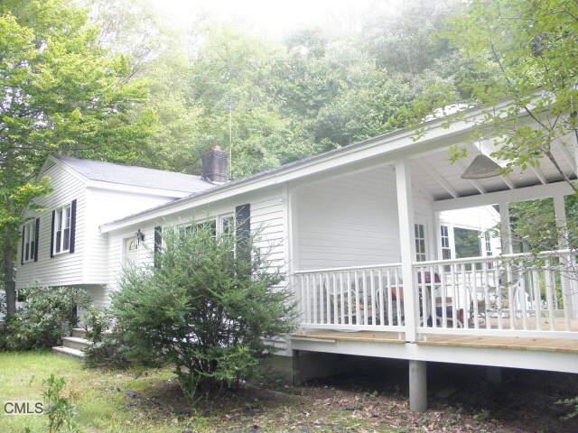 47 Powder Horn Hill Road Wilton, CT 06897 - Photo 1 of 1 a balcony with wooden floor and fence