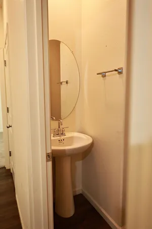 a bathroom with a toilet and a mirror