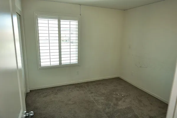 a view of a room that has a window in it