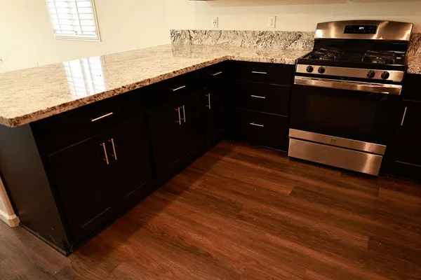 a view of a kitchen from a hallway