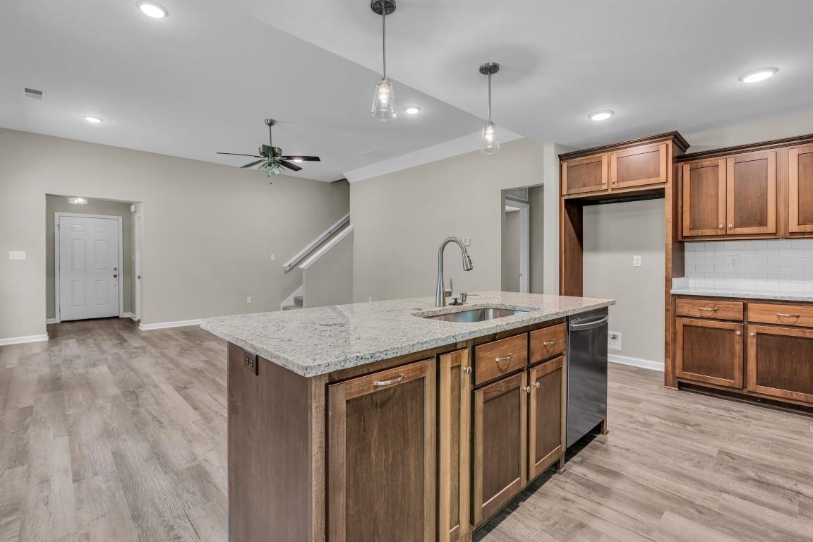 101 Walnut Ridge Ripley, TN 38063 - Photo 13 of 24 a kitchen with a sink a counter space appliances and cabinets