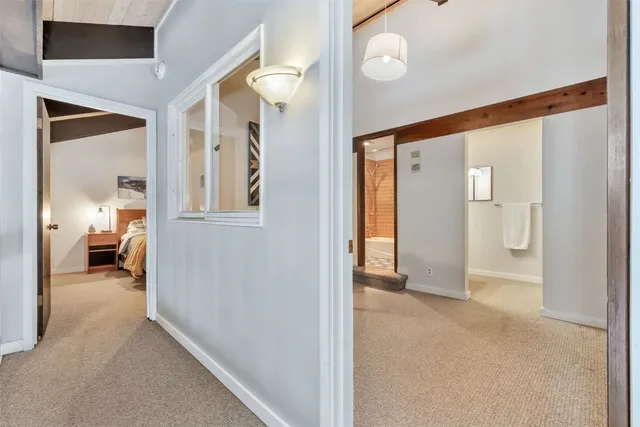 a view of a livingroom and a bathroom