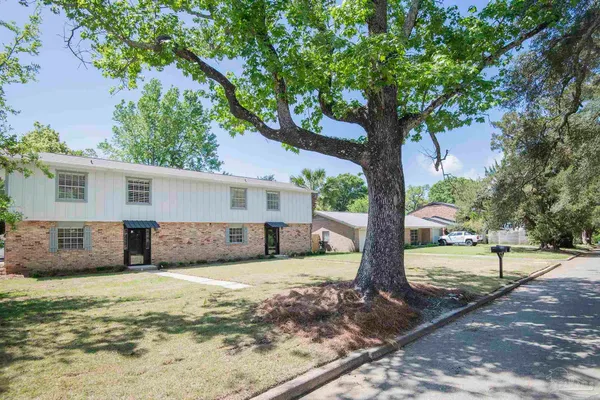 a view of a house with a yard