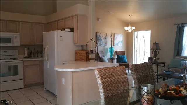 a kitchen with stainless steel appliances a refrigerator and a stove