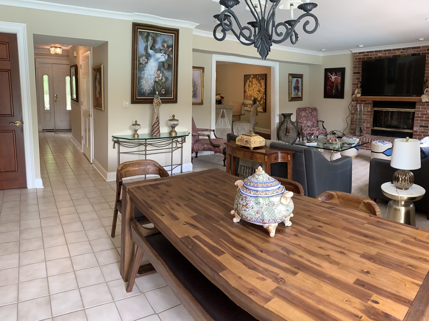 1003 Pember Circle West Dundee, IL 60118 - Photo 24 of 29 a dining hall with couches a flat screen tv and kitchen view