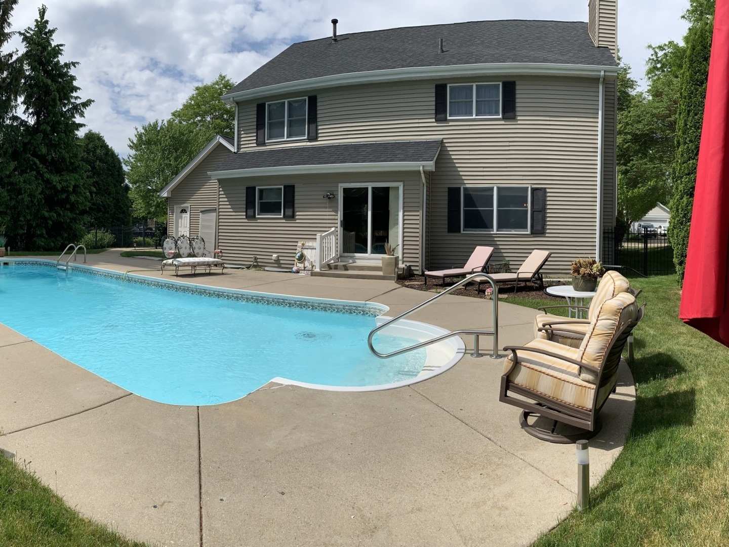 1003 Pember Circle West Dundee, IL 60118 - Photo 4 of 29 a view of a house with backyard sitting area and swimming pool