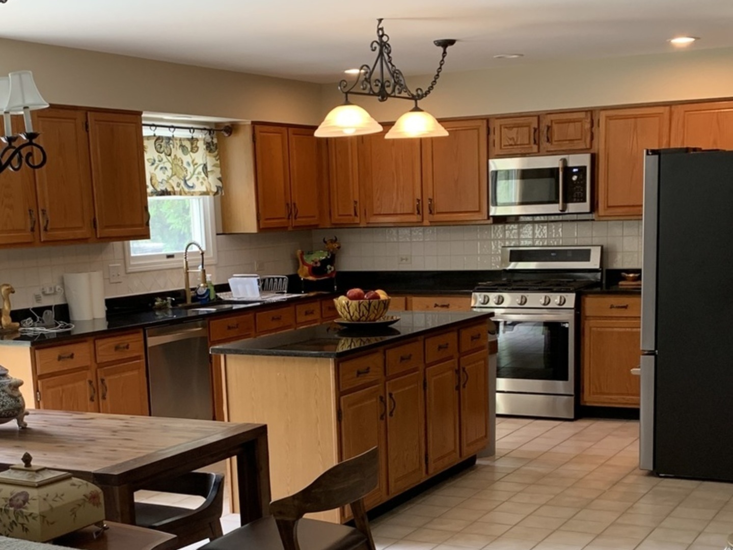1003 Pember Circle West Dundee, IL 60118 - Photo 5 of 29 a kitchen with a stove a sink and a refrigerator