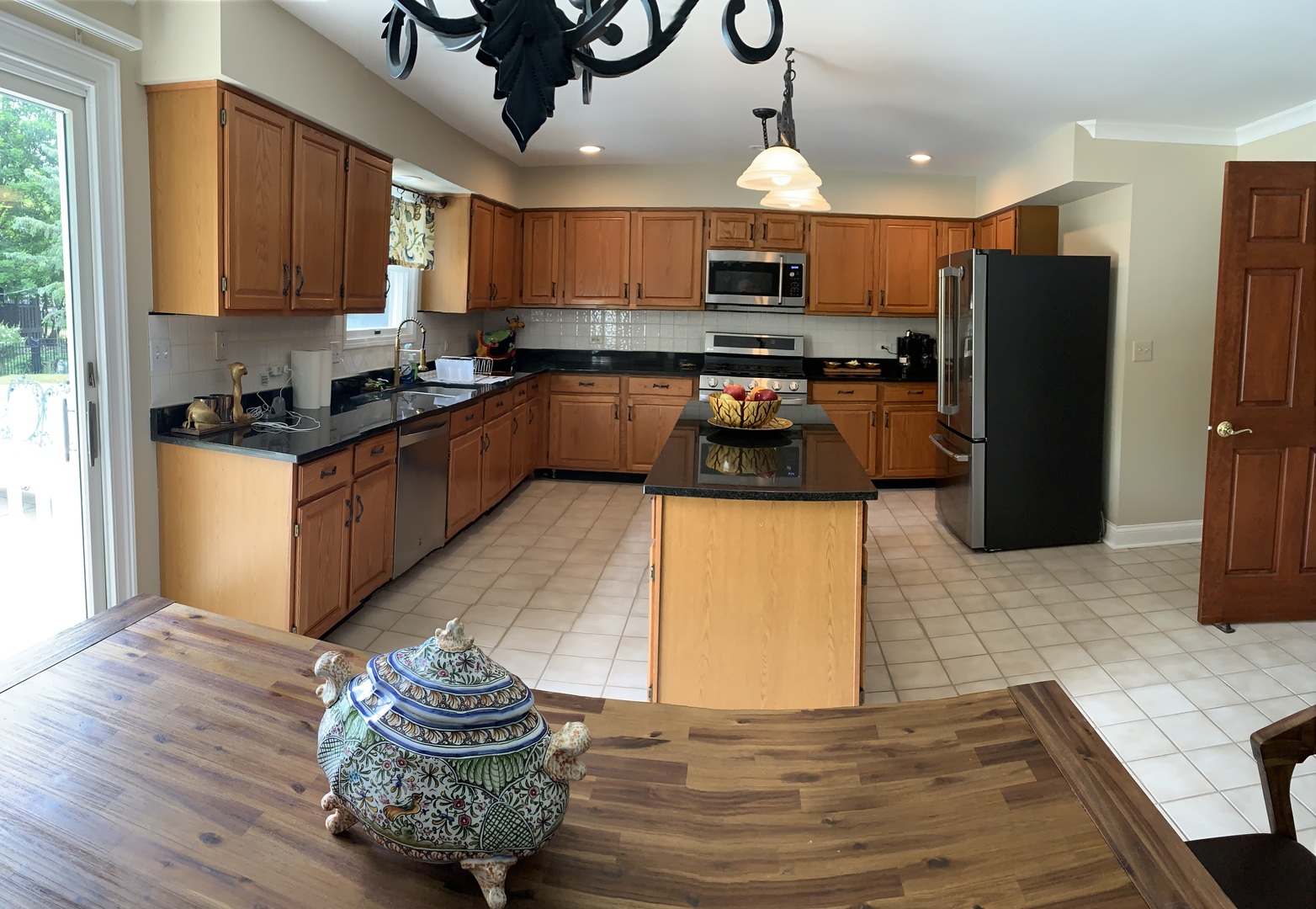 1003 Pember Circle West Dundee, IL 60118 - Photo 6 of 29 a kitchen with stainless steel appliances granite countertop a sink refrigerator stove and microwave