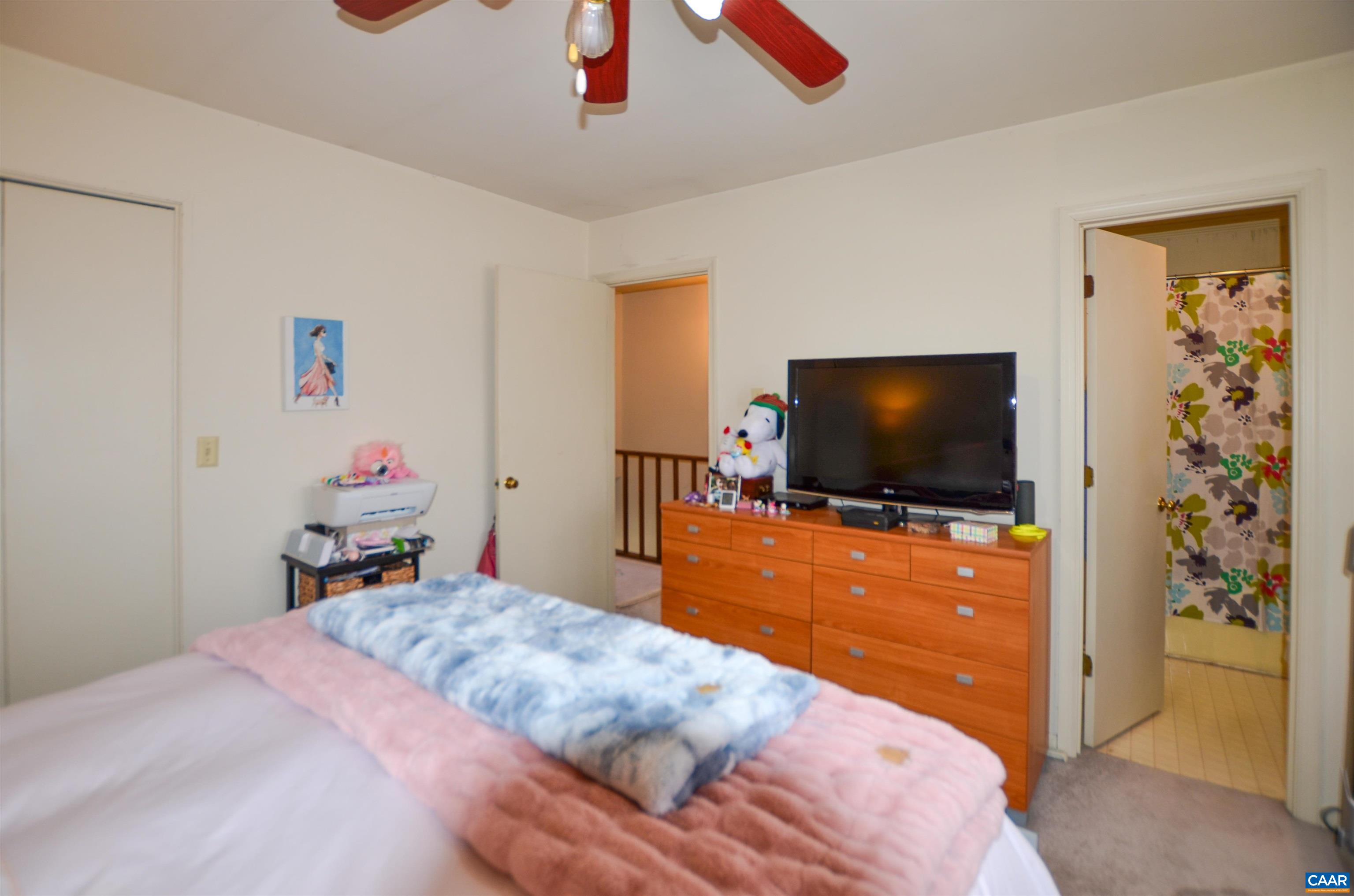 1594 Cool Spring Road Charlottesville, VA 22901 - Photo 18 of 26 a bedroom with a bed and a flat screen tv