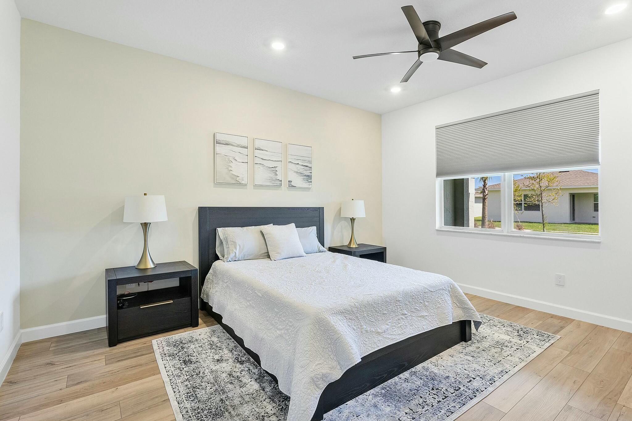 13404 Brotherhood Way Delray Beach, FL 33484 - Photo 14 of 44 a bedroom with a bed and a window