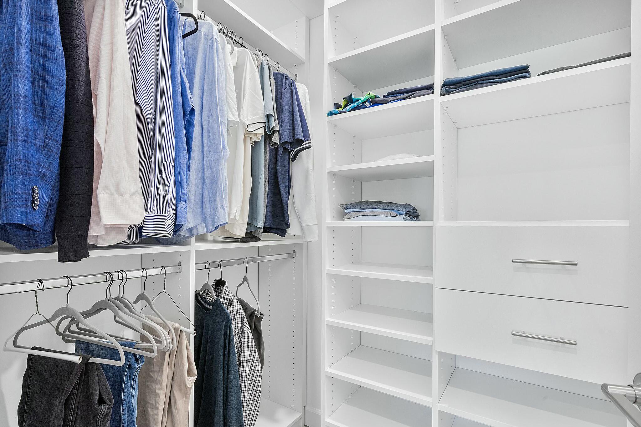 13404 Brotherhood Way Delray Beach, FL 33484 - Photo 19 of 44 a view of walk in closet with clothes and shoes